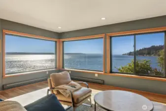 Main floor living room with panoramic, far-reaching views of Mount Rainier, Cascade Mountains, Puget Sound, Des Moines, fireworks displays, boats of all types and sea life!