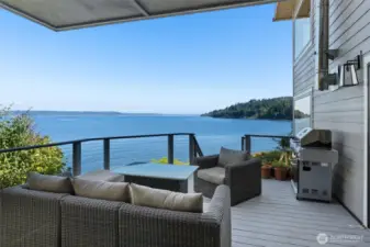 The entertaining size deck on the main floor with steps to the play area and down to beach. The views of Mount Rainier will blow your mind!