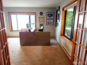 Main floor OFFICE/FLEX/CRAFT ROOM/LOUNGE/GUEST SUITE   with a large walk-in closet and 3/4 bath directly outside the French doors.