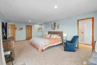 Owner Suite designed like a full hotel room with dual walk-in closets, ensuite luxury bathroom, sitting area, and your own private view deck.