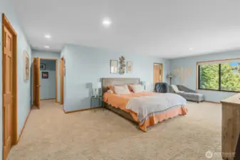 Owner Suite designed like a full hotel room with dual walk-in closets, ensuite luxury bathroom, sitting area, and your own private view deck.