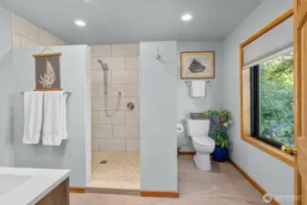 Luxury Owner Suite bathroom with dual vanities, oversized walk-in shower with dual showerheads. You even have views from the toilet in this bathroom.
