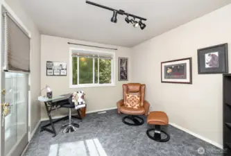 Downstairs den is the perfect flex space for an office, exercise room, or creative studio to suit your needs.