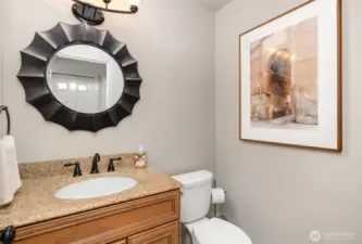 Downstairs half bath, conveniently located off the family room.