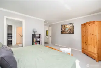 This space receives plenty of natural light through large bedroom window.