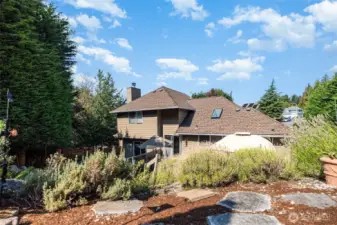 Thoughtfully placed pavers throughout the backyard create peaceful nooks throughout the yard.