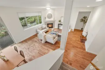 A view of the main floor living area from the stairs leading to the upper bonus room.