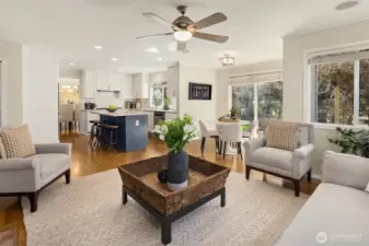 The family room and kitchen areas lead right directly out to the backyard with a stone patio and stunning landscaping.