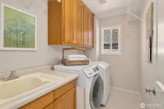 The laundry room is conveniently located on the upper floor.