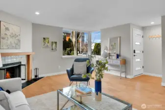 Hardwood floors warm up the living space. That large corner window brings in light.