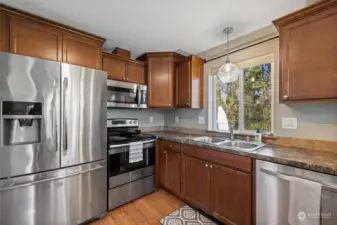 Stainless steel appliances, modern layout and sunny window
