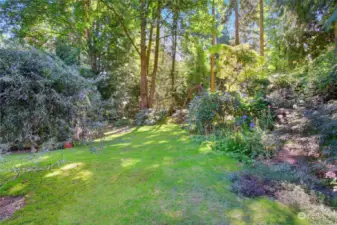 This stunning property is full of unique and exotic plants and trees. Carefully cultivated for almost two decades, the yard is like a painting in the spring and summer.