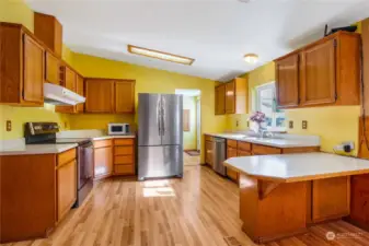 The kitchen window faces the backyard and you get to watch all the little birds and squirrels from the window. All of the appliances (except the little microwave) stay with the home and are fairly new. The skylight provides some natural light.