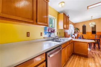 The vaulted ceilings in this home make the kitchen and dining room area look bigger, and you get to enjoy stainless steel appliances.