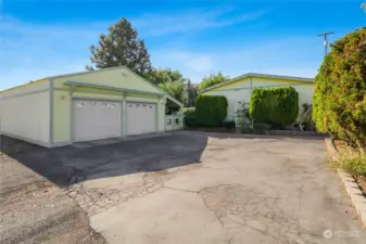 Two-car garage with electric garage door openers and double gate to the back yard and back porch. Alley to the left.