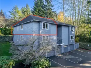 Red outline is the unit. It is the south side of the building. Front door faces east. deck and slider face west