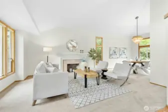 Formal living room with a vaulted ceiling allowing for lots of light.