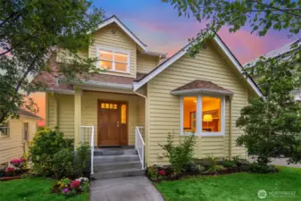 Lush landscaping surrounds home.