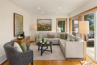 Windows in the family room offer serene views that gently invite the outside in, creating a peaceful backdrop for daily living.