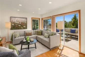 Adjacent to the kitchen, the family room offers an intimate setting for lively chats, where sliding door unlocks a seamless passage to the deck.