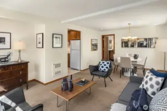 Kitchen and primary bedroom seen from living area.