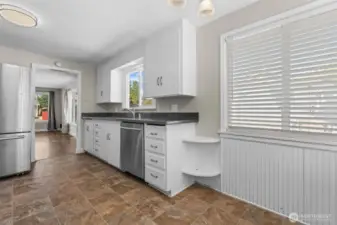 An open layout flows seamlessly into the living and dining areas, making this kitchen the true heart of the home.