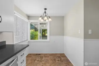 Tucked beside the counter, this eat-in space makes smart use of layout without sacrificing comfort.