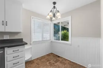 A cozy dining nook sits right inside the kitchen—perfect for quick breakfasts or intimate dinners.