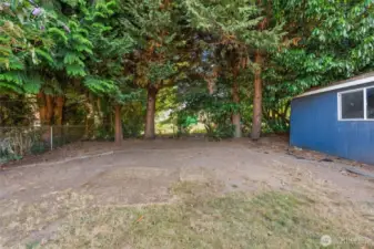 Mature trees provide lovely shade, keeping the yard cool and inviting