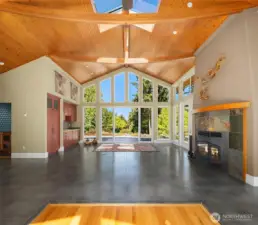 The studio has soaring vaulted ceilings, skylights and a cozy fireplace
