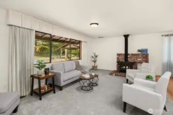 Cozy family room, picture window and wood burning stove to cuddle up to.