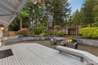 Beautiful, peaceful backyard is perfect for relaxing and/or entertaining with 2 decks, a patio and lovely gardens.