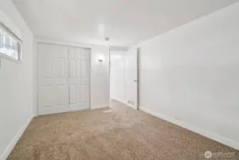 Comfortable primary bedroom offering two separate closets for extra storage.