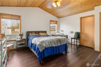 Primary bedroom with walk in closet and bathroom