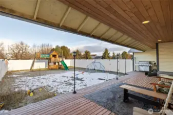 Fully Fenced play yard off of covered deck
