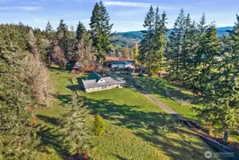 Peaceful 1.78-acre setting tucked back for privacy with room to garden, gather, and grow.