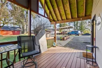 Covered Deck: Perfect for year-round outdoor enjoyment and easy access to the kitchen for outdoor entertaining.