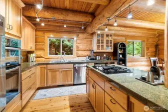 Large open-concept kitchen with ample cabinet storage.
