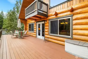French Doors off great room leading to wrap-around deck.