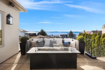Out the French doors to the sunny view deck. Stairs to the yard and garage.