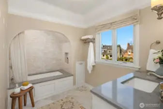 Full bathroom upstairs- timeless arch into the cast iron tub and quartz counters on the vanity
