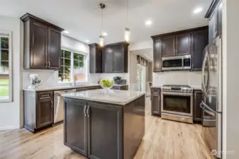The kitchen has been updated and is the heart of this home.  Newer cabinets, beautiful quartz countertops, great lighting, newer appliances.