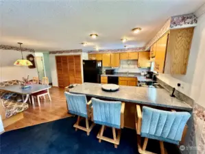 Another view of the kitchen that shows the eating nook.  The washer and dryer are located behind the bi-fold doors as shown above.