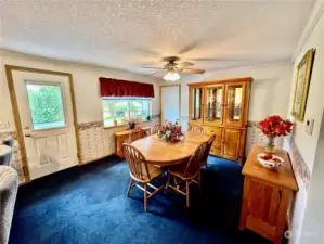 The dining room offer easy access to the rear deck and backyard.