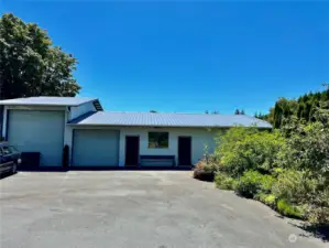 Close up of the detached garage/shop with metal roof and potential, additional living space.