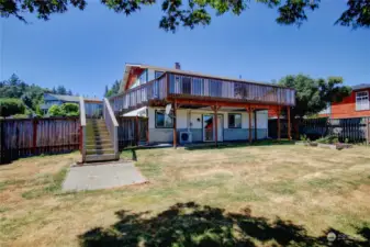 Spacious backyard and stairs to deck