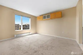 Primary bedroom with tons of natural light and views of City and beyond! un-staged