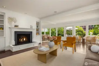 Living room and a wall of windows along the back of the home flood this home with sunshine and light.