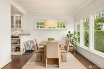 The dining room is open to the living room and the kitchen.  Modern living!