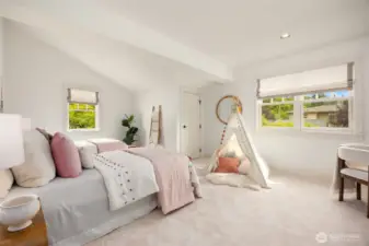 Second bedroom is quite large.  Storage closet is behind that door (toys?), there is a nice sized walk in closet as well.